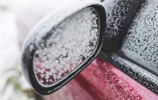 Icy car mirror | Sturgis hail repair